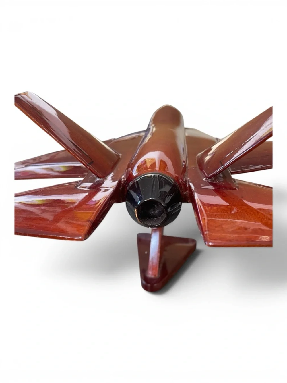 Mahogany wood model of a stealth fighter jet, handcrafted